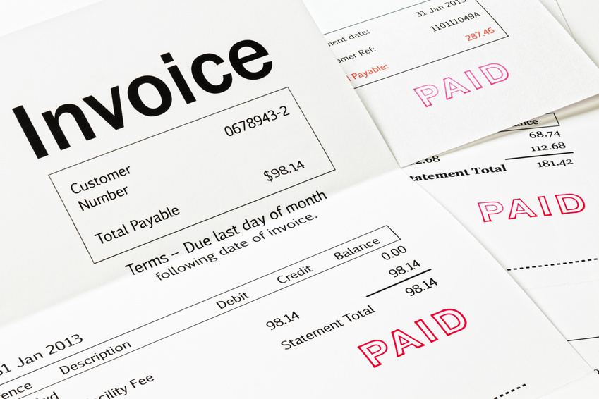 Invoice with Paid Stamp - three invoices with paid stamped on them. All details are imaginary.